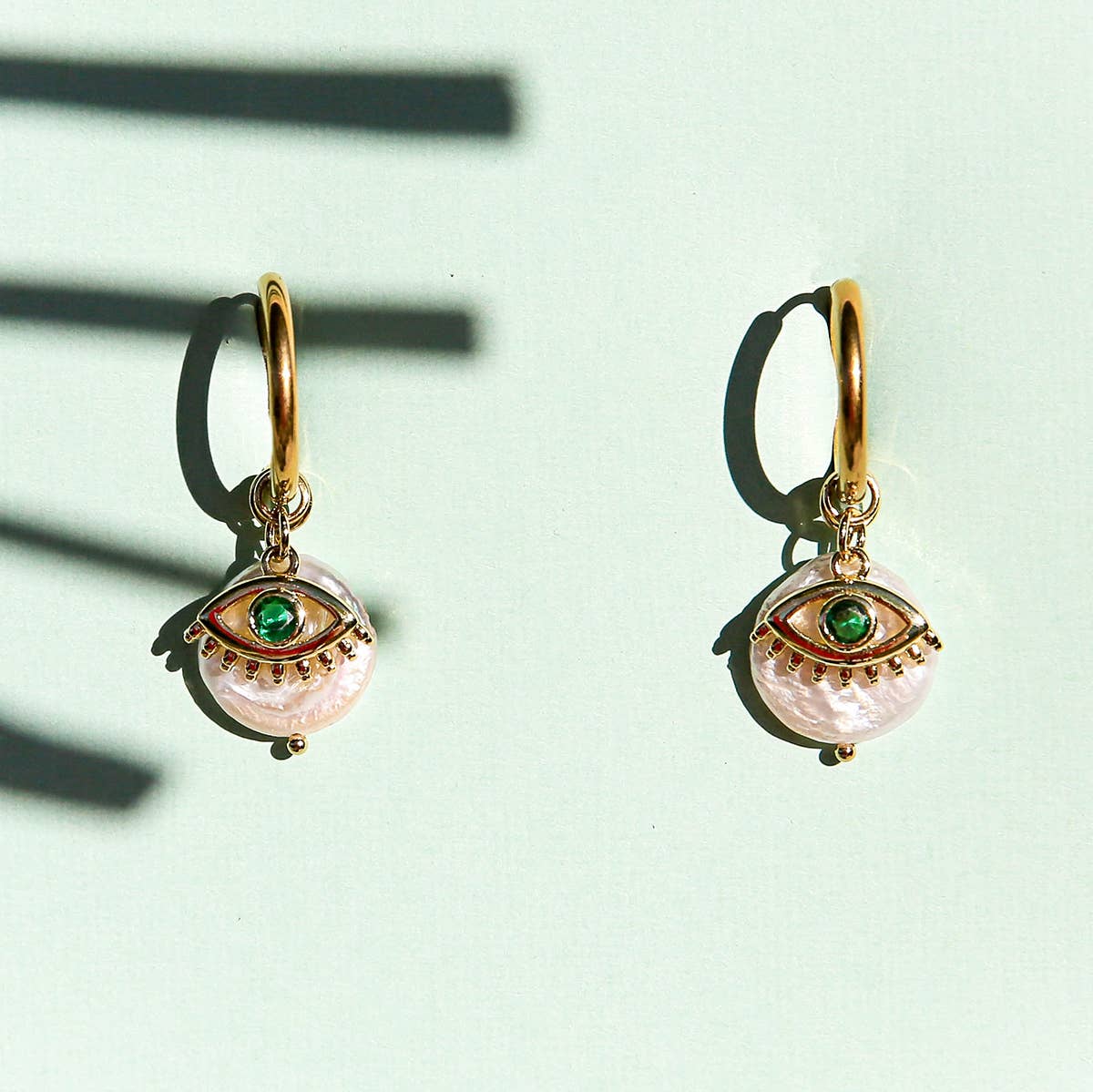 Green Eye Huggie Hoops